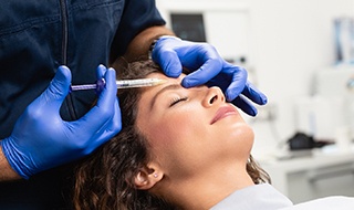Closeup of dentist administering BOTOX® 