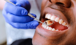 patient getting their teeth examined