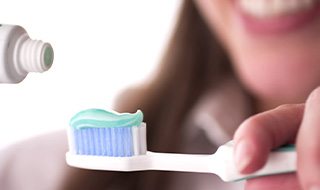Lady prepares to brush teeth