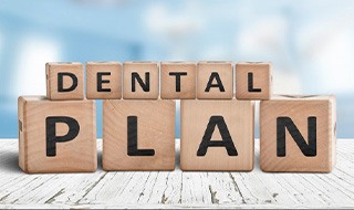 Blocks spell “dental plan”