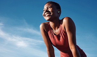 Lady smiles outdoors 