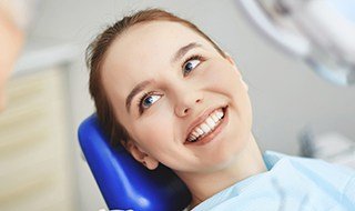 Smiling woman in dental chair