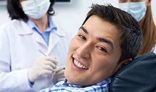 Smiling man in dental chair