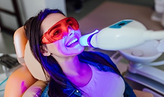 Illustration of replacement teeth being attached to All-on-4 dental implants in Burlington, 