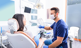 A patient receiving care from a cosmetic dentist in Burlington