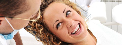 Smiling woman in dental chair