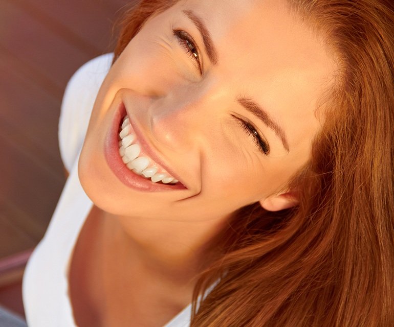 Woman smiling up at the camera