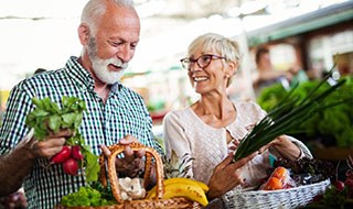 older couple shopping for healthy food