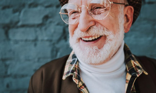 Stylish senior man smiling brightly
