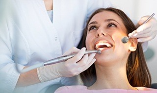 Woman receiving dental exam