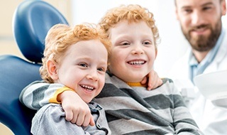 Two little boys in dental chair