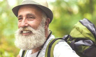 person hiking and smiling