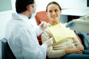 patient speaking with dentist