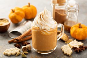 Closeup of seasonal hot drinks next to other fall foods