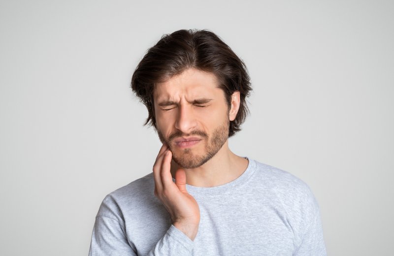 man with tooth pain in Burlington