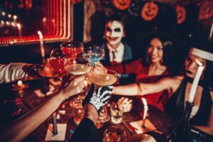 Friends cheering drinks on Halloween